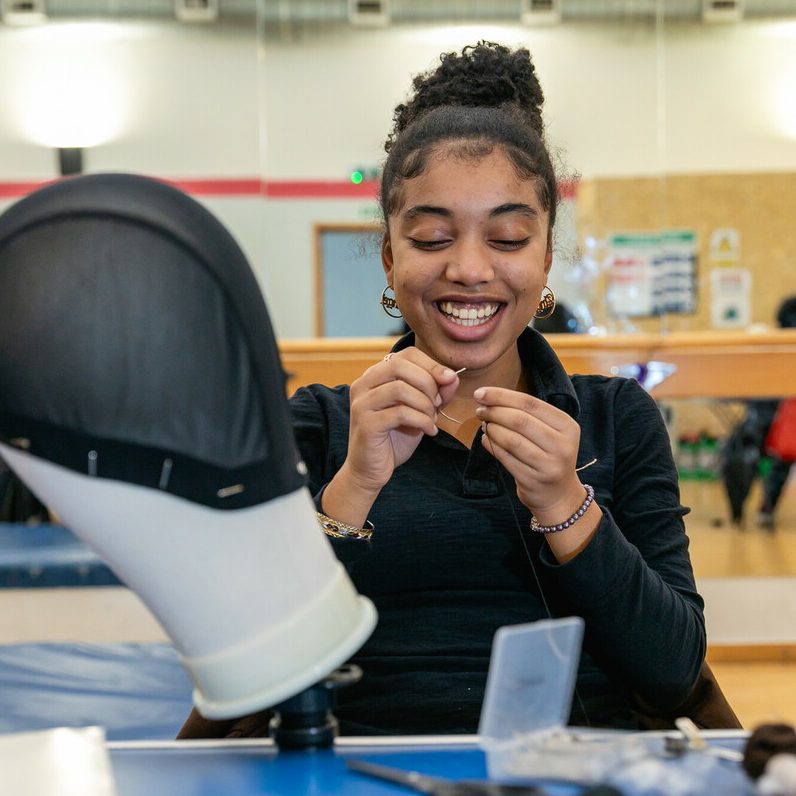teenager making a wig on one of kickstart careers free skills courses