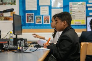 young boy studying in learning zone homework club