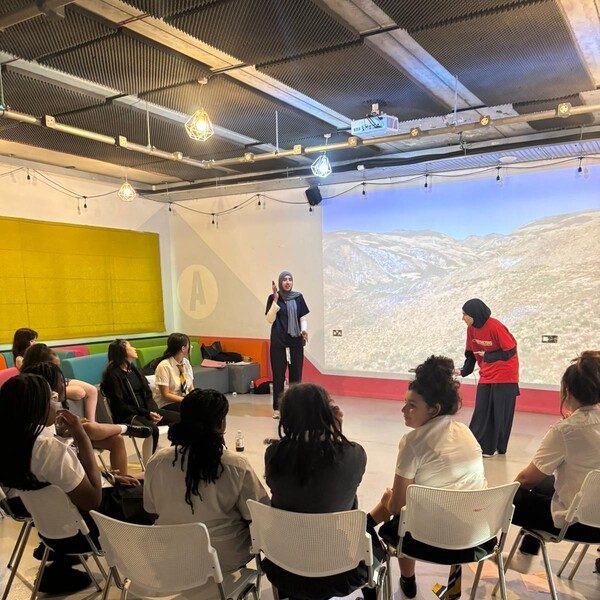 a group of high school aged girls participating in a work shop at Girls' Hub